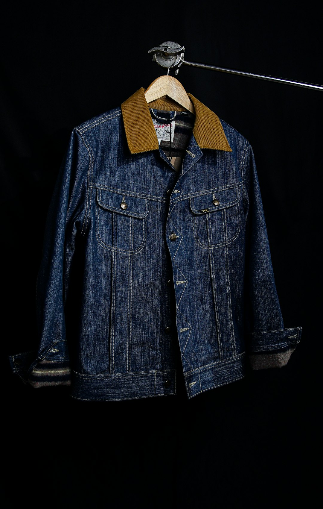 A blue denim button-through jacket