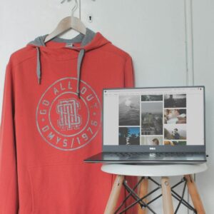 A plain white pullover hoodie photographed flat