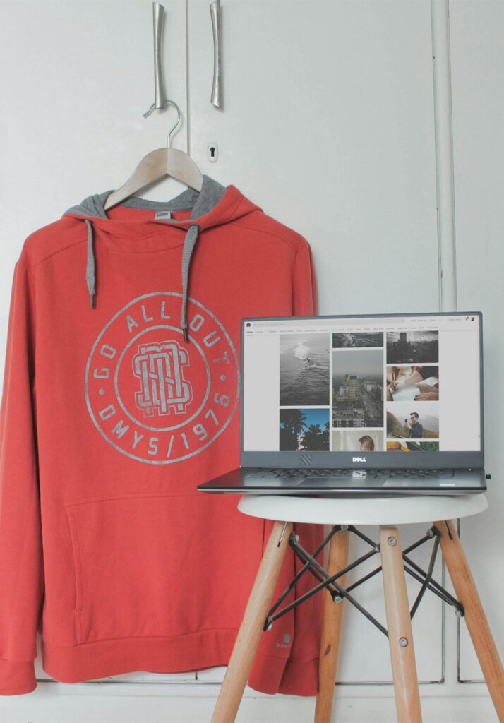 A plain white pullover hoodie photographed flat